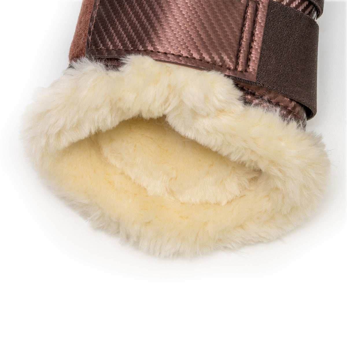 Close-up of a brown equestrian boot with natural fleece lining on a white background