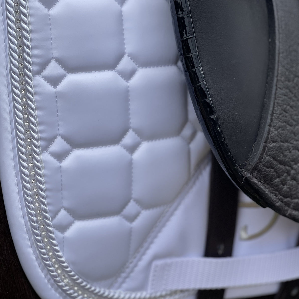 Quilted white satin dressage saddle pad