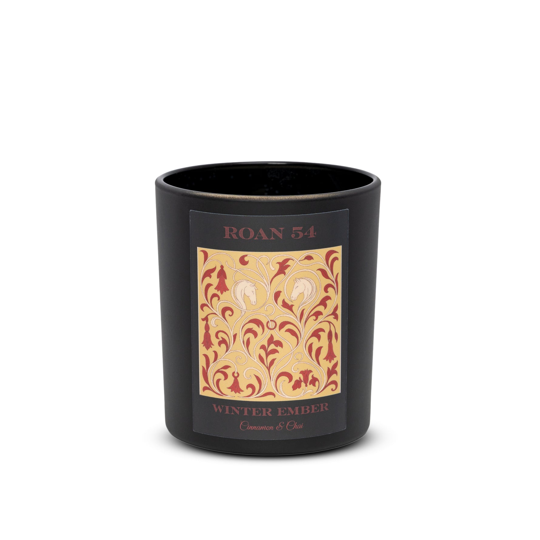A refined winter candle with cinnamon bark, chai spice, and ambered cream. Hand poured soy candle in a matte black vessel. Vegan, cruelty free, and clean burning.